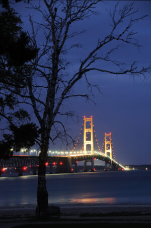 The Mackinac Bridge illuminated at dusk, a serene capture by Ken Osborne