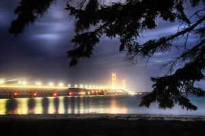 Nighttime view of the illuminated Mackinaw Bridge by Ken Osborne