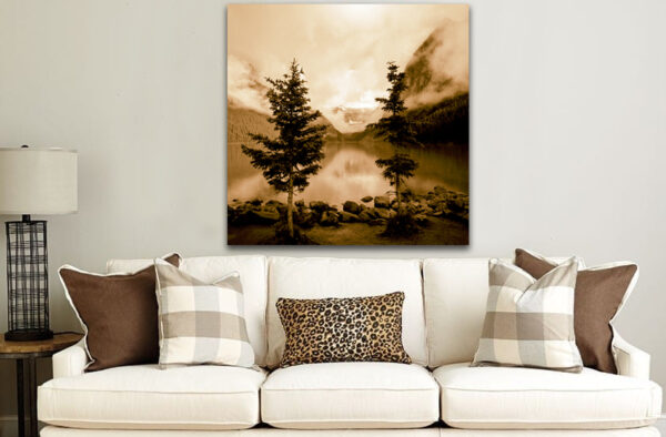 "Whispering Dawn" sepia-toned landscape artwork displayed above a white sofa