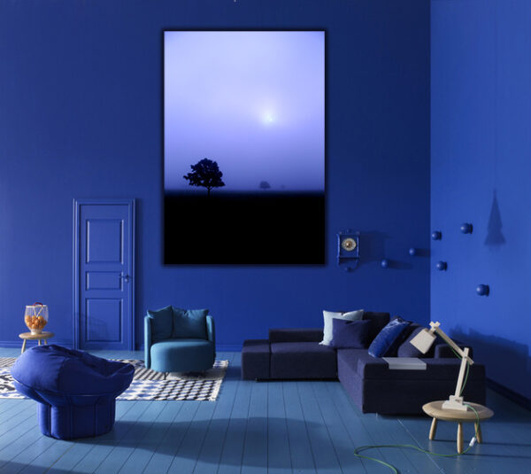 "Misty Morning Solitude" by Ken Osborne, showcased in a modern living room with blue walls.