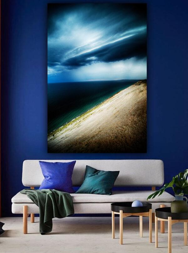 "Tempest at the Dunes" photograph in a modern interior with a vibrant blue wall, adding elegance to home decor.