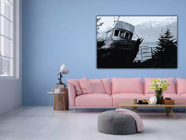 "The Last Voyage" - A timeless black and white photograph of an aged fishing boat, presented against the backdrop of calm seas and mountains, adding a narrative of adventure and nostalgia to a contemporary living space.